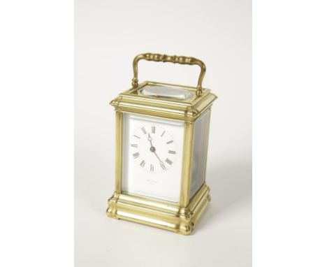 A FRENCH CARRIAGE CLOCK, the white enamelled dial with Roman numerals, inscribed " Hatty & Son Paris", the movement striking 