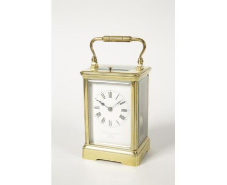 A FRENCH BRASS CASED REPEATING CARRIAGE CLOCK, the white enamelled dial with Roman numerals inscribed "Z. Barraclough & Sons,