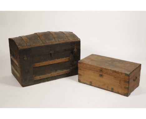 A VICTORIAN DOME TOP TRAVELLING TRUNK with metal and wooden banding, 23" high x 34" wide, and a similar camphorwood chest, 28