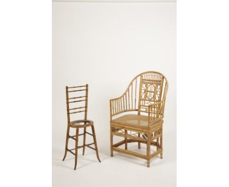 A "CHINESE CHIPPENDALE" STYLE BAMBOO ARMCHAIR with a dished arched back with scrolling splat above a caned seat, 41.5" high, 