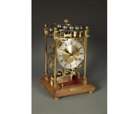 A LIMITED EDITION SPHERICAL WEIGHT CLOCK, the silvered chapter ring with roman numerals, inscribed " Harding & Bazeley Chelte