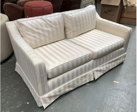 A two seater sofa in a striped cream fabric, 90cmD 152cmW 