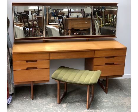 A mid century dressing table, three part mirror and light, kneehole with seven drawers, 152x45x71cmH; together with a matchin