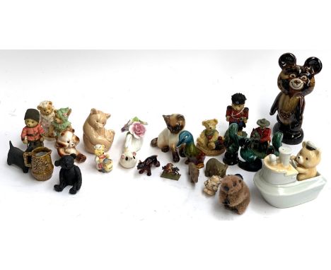 A mixed lot of ceramics to include Poole pottery bear; Highbank dog; Blue Mountain figures; fluffy beaver; heavy brass bear e