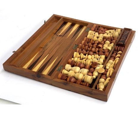 A cased burr wood chess/backgammon set with pieces 