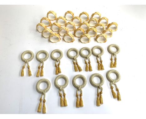A set of 12 ropetwist and gilt metal napkin rings; together with a further 24 ceramic ropetwist napkin rings 