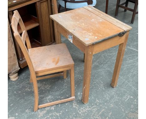 A vintage beech schoolboys desk, 56x46x70cmH; together with matching chair 