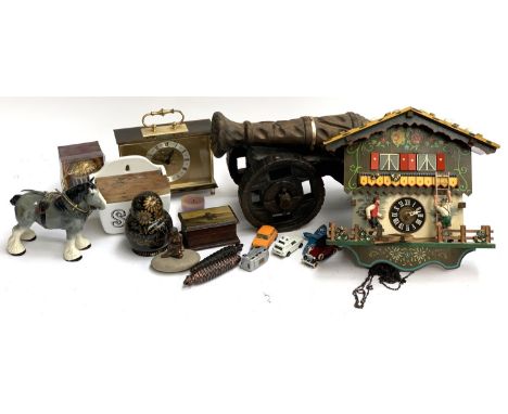 A mixed lot to include cuckoo clock; large carved wooden cannon; Russian doll; Salt box; Corgi model vehicle etc 