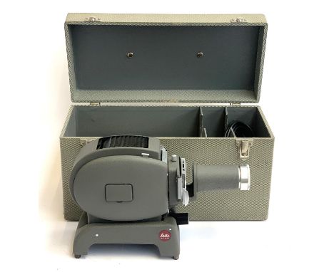 A Leitz Wetzlar Prado projector, cased, together with a large quantity of reels 