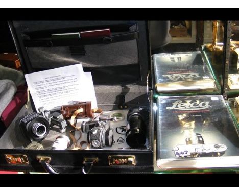 Selection of Leica camera accessories, including Telyt lens, Elmar lens, Visoflex adaptor, together with book CONDITION REPOR