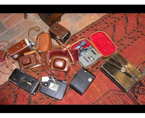 Interesting collection of vintage cameras, including the Kodak 8 Model 20, Cronica-8, etc. 