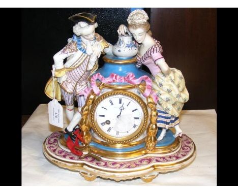 A French ceramic and gilt mantel clock - 30cm high 