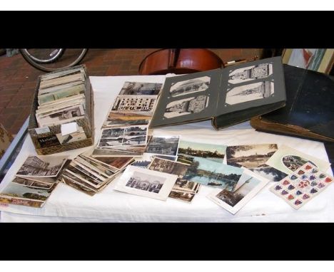 Two vintage postcard albums, together with 500 British topographical postcards 