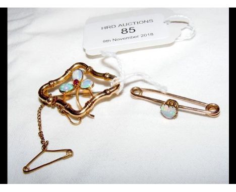 An opal brooch in gold setting, together with one other 