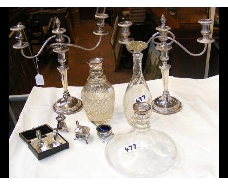 A pair of silver plated candelabra, decanter, etc. CONDITION REPORTShips decanter missing stopper. No cracks or chips. Decant