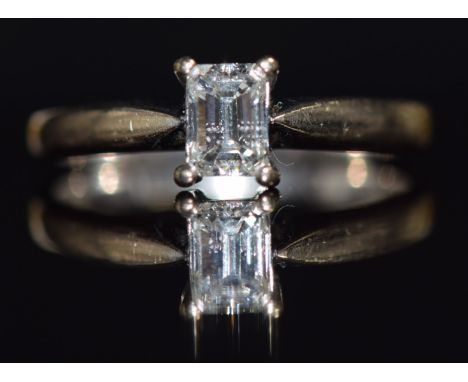 An 18ct white gold ring set with an emerald cut diamond of approximately 0.5ct, size M, 3g