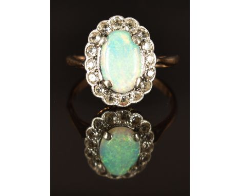 A 9ct gold ring set with an opal and white sapphires, size K, 2.3g&nbsp;