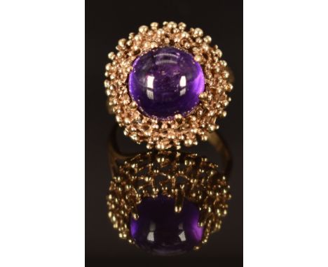 A 9ct gold ring set with an amethyst cabochon, size K/L, 5g&nbsp;