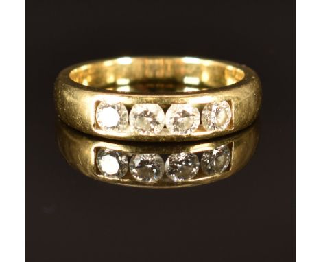 An 18ct gold ring set with four round cut diamonds, size M, 4.9g&nbsp;