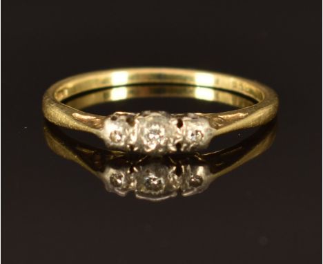 An 18ct gold ring set with three diamonds, size L/M, 1.8g&nbsp;