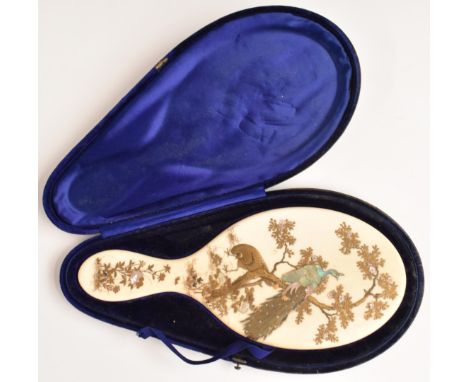 Japanese 19thC Meiji period ivory mirror back with shibayama decoration of peacocks and butterflies amongst trees and foliage