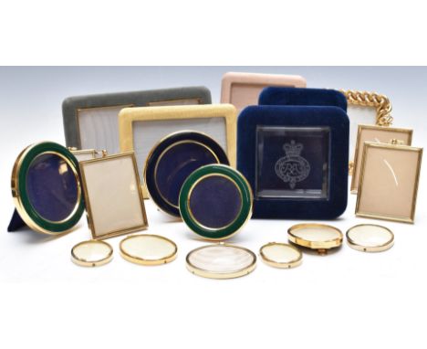 Photograph and portrait miniature frames to include three circular enamel examples, one with engraved royal motto, most havin