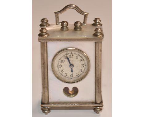 Miniature c1930s carriage style clock with blue steel hands on engine turned Arabic dial, in silver plated case with mother o