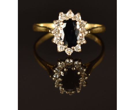 An 18ct gold ring set with a sapphire and diamonds, size K/L, 2.7g&nbsp;
