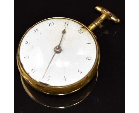 E Woodard of London gold plated open faced pocket watch with gold hands, black Arabic numerals, white enamel dial, pierced ba