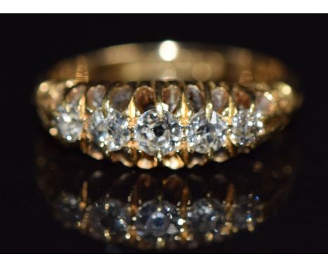 An 18ct gold ring set with five old cut diamonds, Birmingham 1911, size L/M, 3.5g&nbsp;