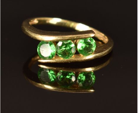 A 9k gold ring set with three round cut tsavorite garnets, size L/M, 2.2g&nbsp;