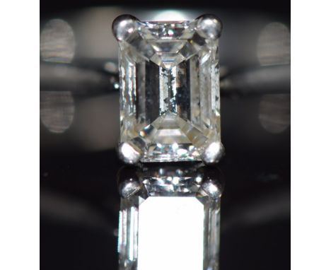 A platinum ring set with an emerald cut diamond of approximately 1.02ct, with original receipt for £5,600, size K, 5.7g&nbsp;