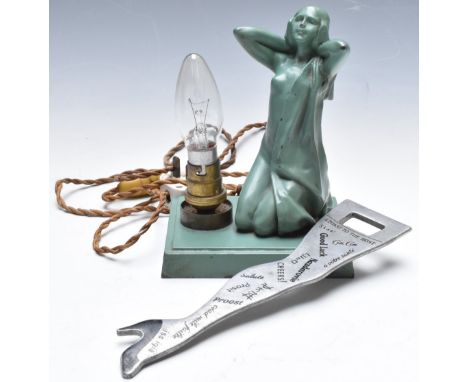 Novelty cast metal lamp base formed as a nude lady, H18cm, together with a novelty lady's leg bottle opener