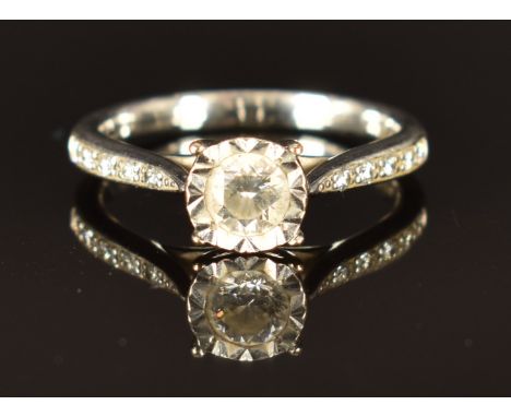 A 9ct white gold ring set with diamonds totalling approximately 0.4ct, size K, 2.6g