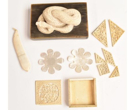 Oriental ivory game, carved snake on base, two mother of pearl sewing accessories and a ivory novelty needle case formed as a