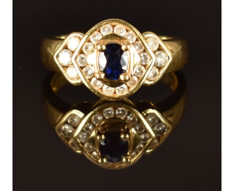 An 18ct gold ring set with a sapphire and diamonds, size K/L, 6.3g&nbsp;