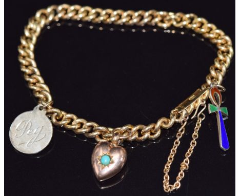 An 18ct gold curb link bracelet with an Edwardian 9ct rose gold heart charm set with turquoise, a St Christopher and a silver