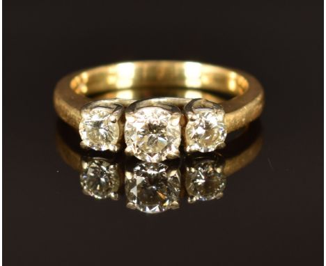 A 10k gold ring set with three diamonds, total diamond weight approximately 0.8ct, size M, 4.3g&nbsp;