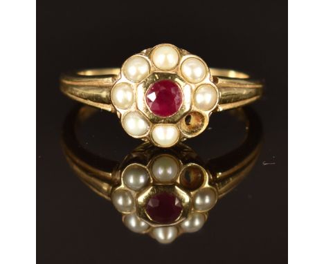 A 9ct gold ring set with a ruby surrounded by pearls, size M, 2.8g&nbsp;