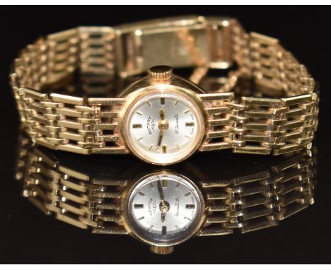 Rotary 9ct gold ladies wristwatch with gold hands and hour markers, silver dial and 21 jewel movement, on 9ct gold bracelet, 
