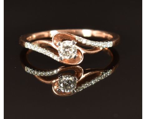 A 9ct rose gold ring set with diamonds in a twist setting, size M, 1.8g&nbsp;