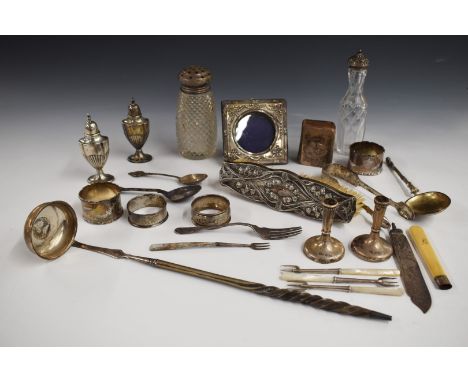 Hallmarked silver items to include pair of napkin rings and further napkin ring, pair of peppers, sugar tongs etc, 277g weigh