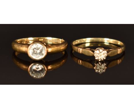 A 9ct gold ring set with cubic zirconia (size L, 1.7g) and a 9ct gold ring set with a diamond, size M/N, 1.2g