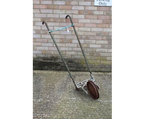 Manual plough with wheel and two blades