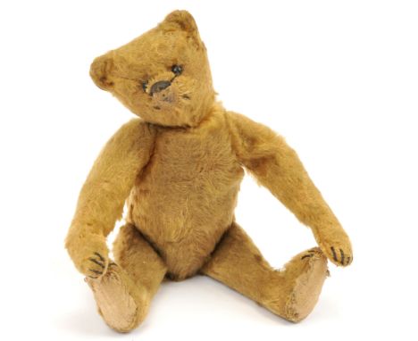 Steiff golden mohair teddy bear, German, c1910, complete with small underscored "f" button, black horizontally stitched nose,