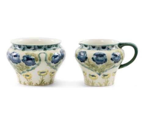 WILLIAM MOORCROFT FOR JAMES MACINTYRE & CO: FLORIAN MILK JUG & SUGAR BOWL, painted with poppies in blue, green and yellow, br