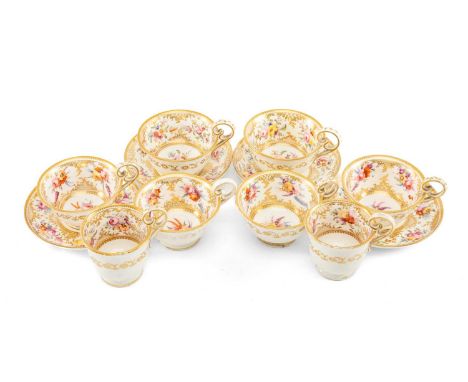 COALPORT PORCELAIN TEA & COFFEE CUPS, pattern no. 830, decorated with sprays of summer flowers within lavish gilt borders, co