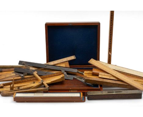 ASSORTED MEASURING TREEN including foot measures, slide rules, brass and mahogany spirit level, brass chart ruler etc.Provena