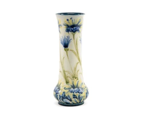 WILLIAM MOORCROFT FOR JAMES MACINTYRE & CO: FLORIAN VASE, painted with cornflowers in blue, yellow and green, brown printed m