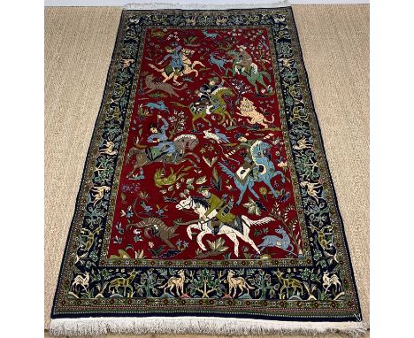 MODERN KASHAN STYLE HUNTING RUG, decorated with mounted huntsmen and wild animals on a madder field, wild animals and shrubs 